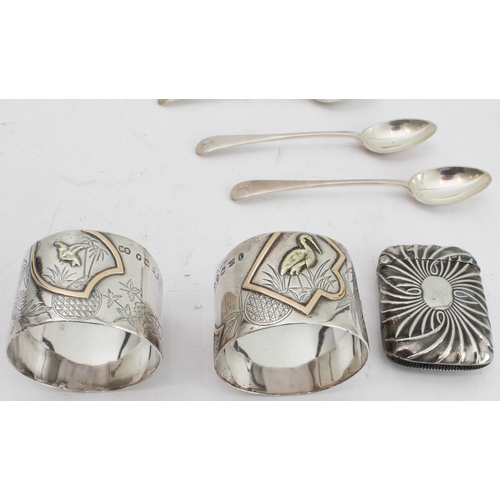 91 - Hallmarked silver comprising:
 an interesting pair of late 19th century napkin rings decorated in re... 