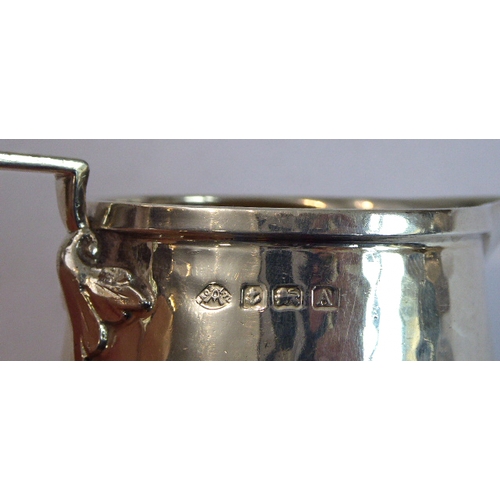 103 - A good hand-planished, hallmarked silver three-piece Arts and Crafts tea service to comprise: 
 a te... 