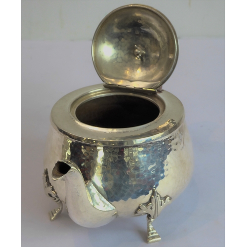 103 - A good hand-planished, hallmarked silver three-piece Arts and Crafts tea service to comprise: 
 a te... 