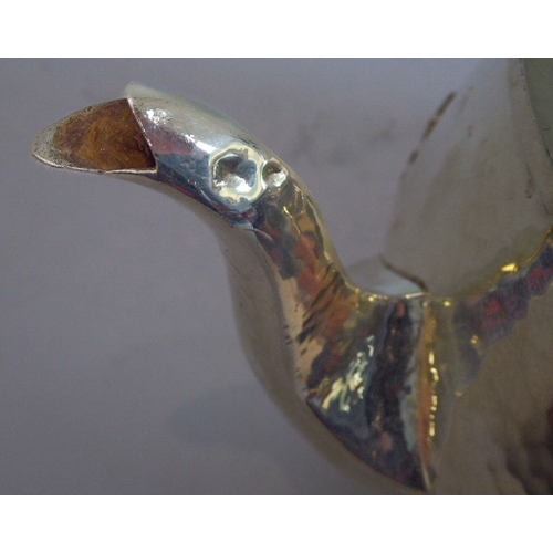 103 - A good hand-planished, hallmarked silver three-piece Arts and Crafts tea service to comprise: 
 a te... 