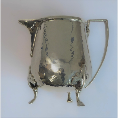 103 - A good hand-planished, hallmarked silver three-piece Arts and Crafts tea service to comprise: 
 a te... 