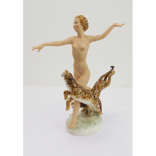 19 - A fine, rare and unusual Jugendstil porcelain figure: an exuberant Circe with leopards; the female f... 