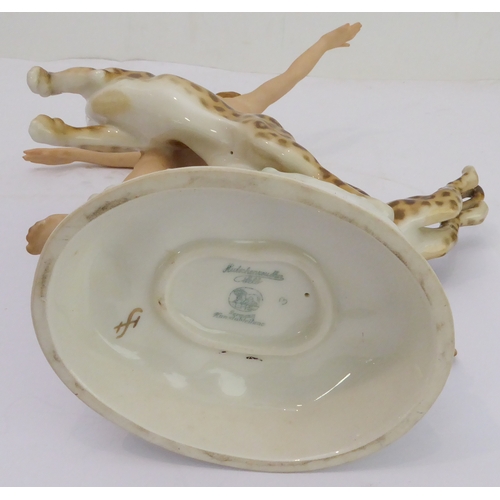 19 - A fine, rare and unusual Jugendstil porcelain figure: an exuberant Circe with leopards; the female f... 