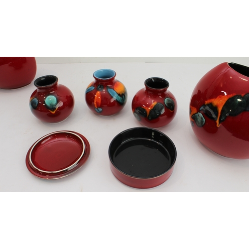 2 - Seven pieces of Poole studio ware pottery:
 a large charger (40 cm in diameter);
 five vases (two pa... 