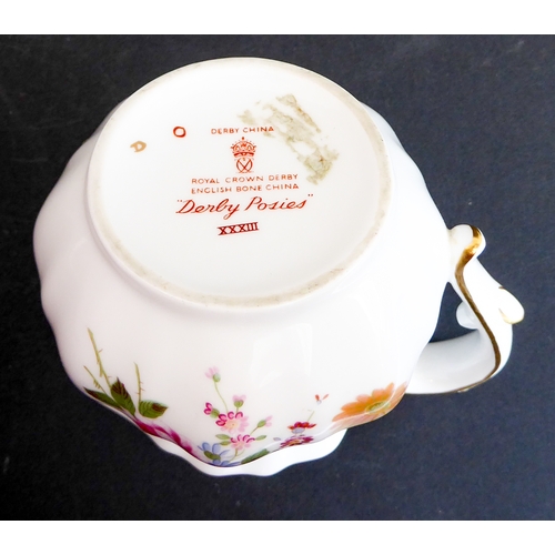 28 - A Royal Crown Derby 'Derby Posies' six-place service comprising tea and coffee cups and saucers, sid... 