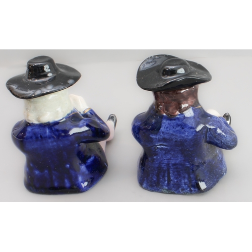 31 - A pair of 19th century seated Staffordshire figures (as pots with removeable hats, minor damage) (8.... 