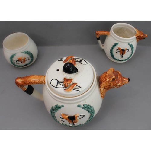 41 - A mixed lot of eight hunting themed pieces:
 1. a three-piece ceramic tea service with foxhunting de... 