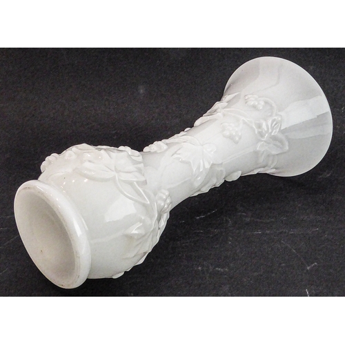 46 - A Napoleon III period (1845-1870) Baccarat opaline vase of trumpet form and decorated in high relief... 