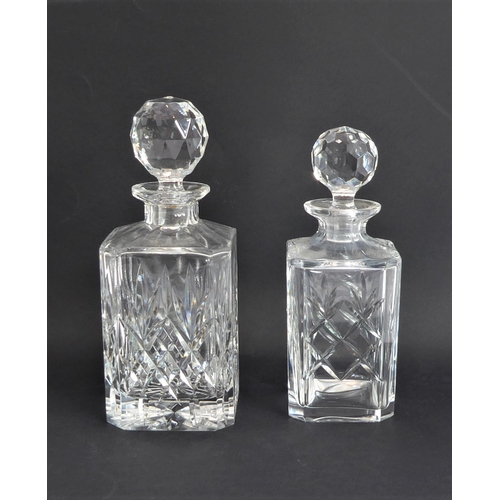 52 - Four quality glass decanters:
 a modern hand-cut mallet-shaped decanter and stopper ;
 a hand-cut sp... 