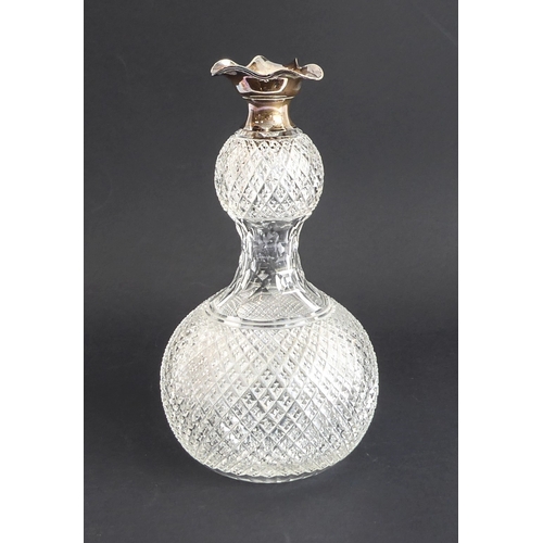 52 - Four quality glass decanters:
 a modern hand-cut mallet-shaped decanter and stopper ;
 a hand-cut sp... 