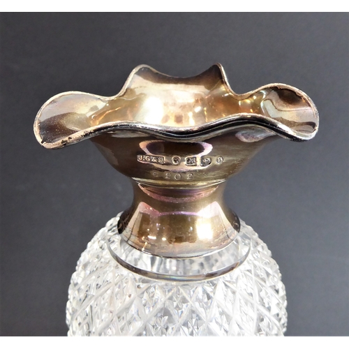 52 - Four quality glass decanters:
 a modern hand-cut mallet-shaped decanter and stopper ;
 a hand-cut sp... 