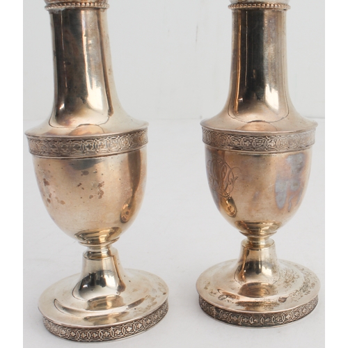 70 - A pair of early 20th century Tiffany & Co. sterling silver pepperettes, each with Celtic-style bands... 