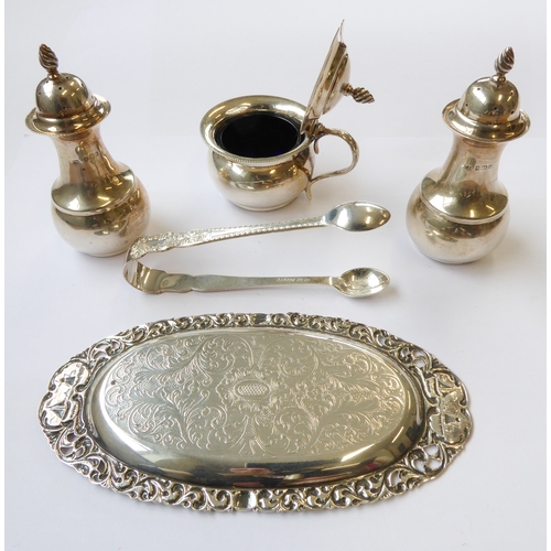 98 - A group of five:
 a pair of baluster-shaped hallmarked silver pepperettes and matching mustard with ... 
