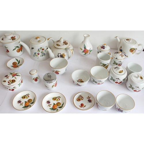 14 - A mixed lot of Royal Worcester (mostly 'Evesham' and a few 'Arden') comprising:
 3 teapots;
 7 sugar... 