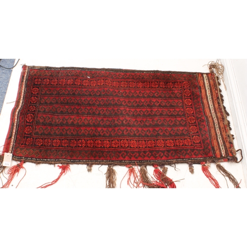 331 - Two early to mid 20th century hand-woven tribal saddlebags with red grounds and stylised repeating p... 