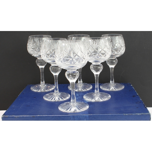 51 - A boxed set of six finely cut clear-glass hock glasses with star-cut bases