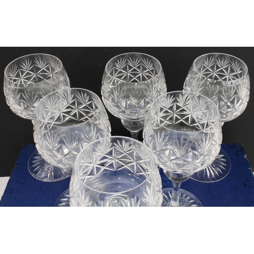 51 - A boxed set of six finely cut clear-glass hock glasses with star-cut bases