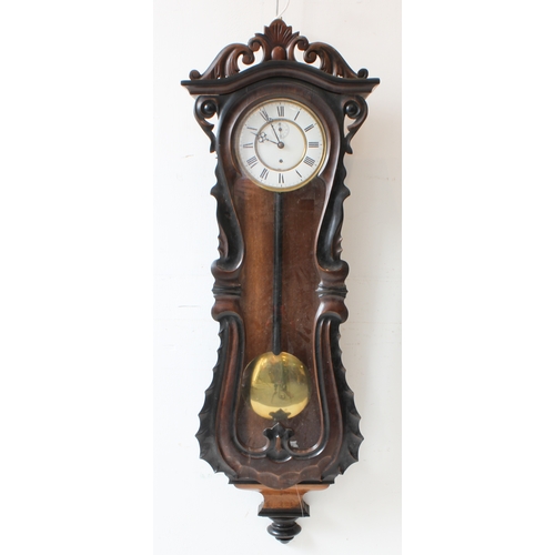 127 - A large 19th century walnut-cased continental Vienna regulator-style wall-hanging clock: the foliate... 