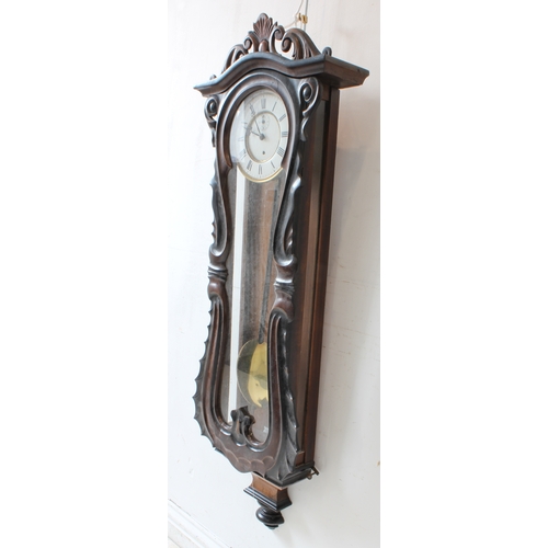 127 - A large 19th century walnut-cased continental Vienna regulator-style wall-hanging clock: the foliate... 