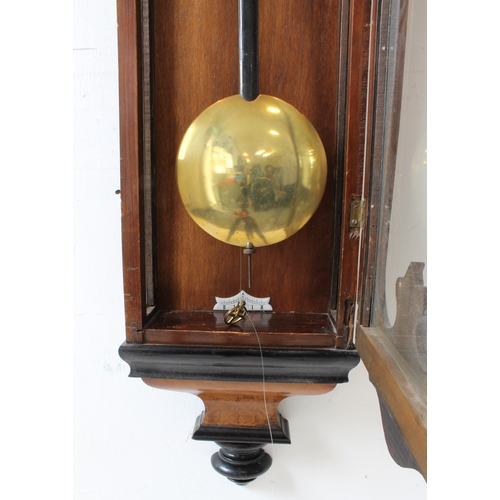 127 - A large 19th century walnut-cased continental Vienna regulator-style wall-hanging clock: the foliate... 