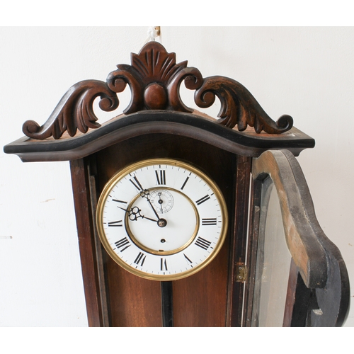 127 - A large 19th century walnut-cased continental Vienna regulator-style wall-hanging clock: the foliate... 