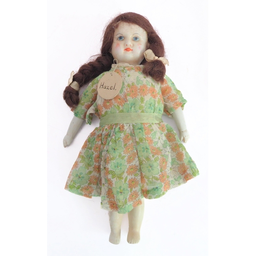 149 - Fifteen collector's dolls to include composition dolls and a bear dressed in long red coat with dog ... 