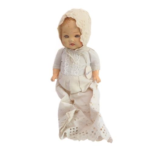 149 - Fifteen collector's dolls to include composition dolls and a bear dressed in long red coat with dog ... 