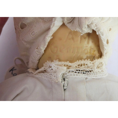 149 - Fifteen collector's dolls to include composition dolls and a bear dressed in long red coat with dog ... 