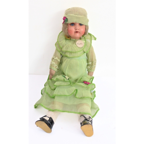 149 - Fifteen collector's dolls to include composition dolls and a bear dressed in long red coat with dog ... 