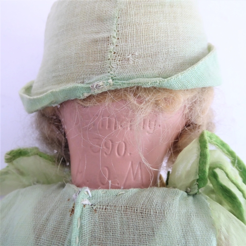 149 - Fifteen collector's dolls to include composition dolls and a bear dressed in long red coat with dog ... 