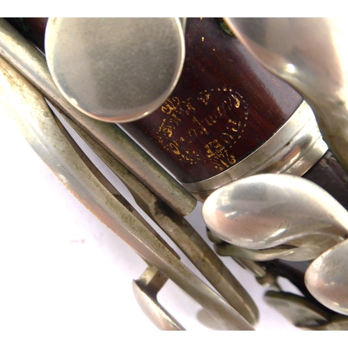 168 - A Buffet Crampon (Paris) basset horn: both hardwood sections with maker's gilt stamp and the bell so... 