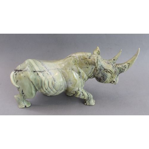 171 - A pair of heavy carved stone rhinoceri Buttqsade (Shona), Rhodesia, realistically modelled from band... 