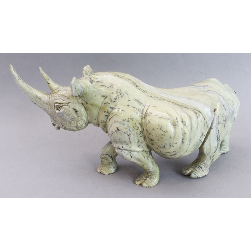 171 - A pair of heavy carved stone rhinoceri Buttqsade (Shona), Rhodesia, realistically modelled from band... 