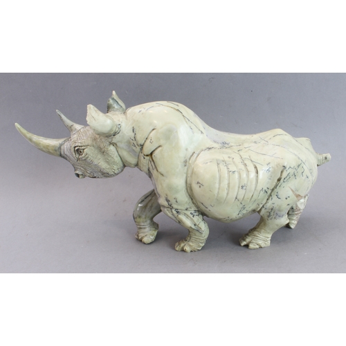 171 - A pair of heavy carved stone rhinoceri Buttqsade (Shona), Rhodesia, realistically modelled from band... 