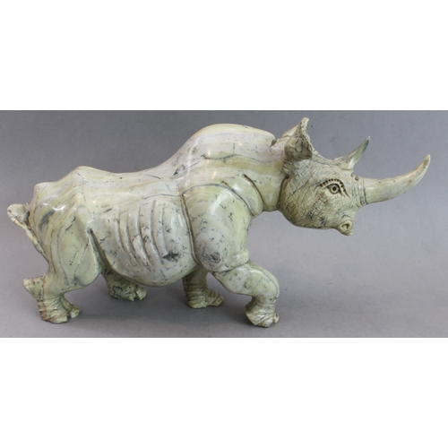 171 - A pair of heavy carved stone rhinoceri Buttqsade (Shona), Rhodesia, realistically modelled from band... 