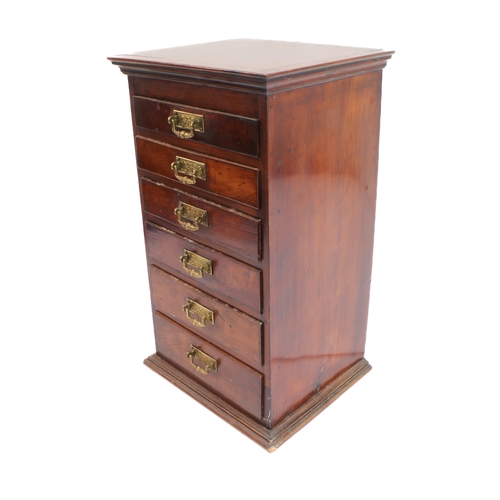 178 - A late 19th century tabletop bank of mahogany/fruitwood (?) drawers: cleated slightly overhanging mo... 