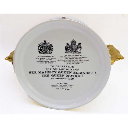 3 - A fine Paragon English Bone China two-handled loving cup: finely hand-gilded and the two handles mod... 