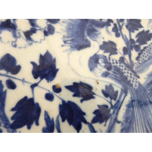 4 - Two pieces:
 1. a 19th century Chinese blue-and-white porcelain charger decorated with exotic birds ... 