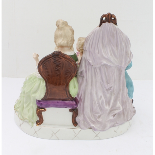 16 - Two pieces:
 1. a 20th century hand-decorated porcelain figure model, an artist drawing a seated lad... 