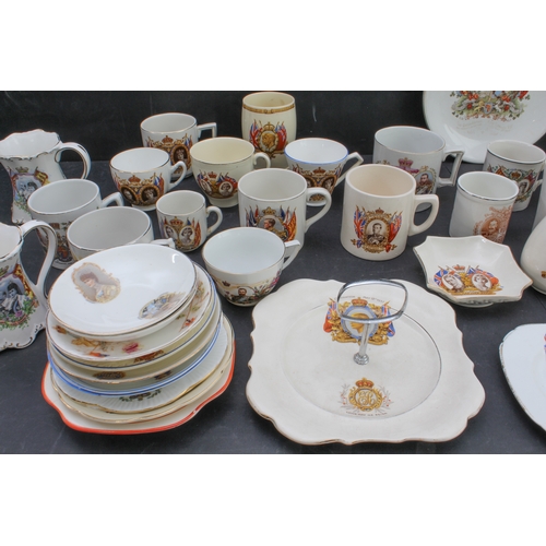 31 - A collection of royal commemorative tankards, cups and saucers, and plates (mostly early to mid 20th... 