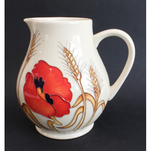 11 - A modern Moorcroft pottery jug of of Art Nouveau inspiration: baluster form, decorated with poppies ... 