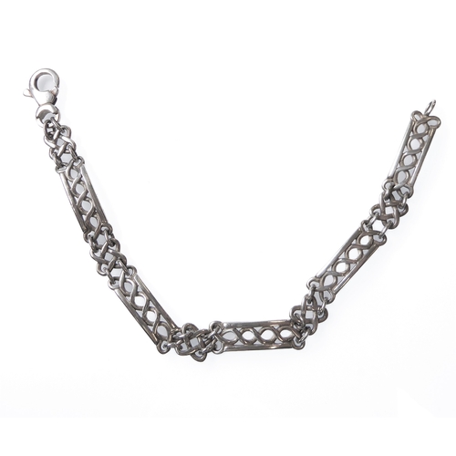 119 - A heavy silver bracelet: the five horizontal links in a running guilloché style (19cm, boxed)