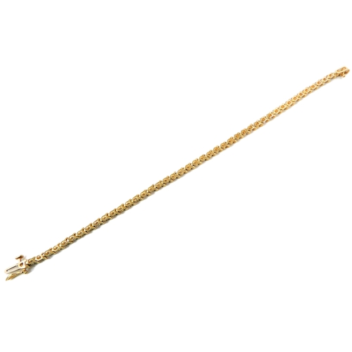 121 - A 14ct gold and diamond tennis bracelet (marked 14K to the clasp), each link illusion set a single c... 