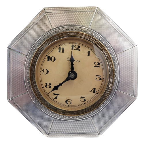 126 - *** DESCRIPTION REVISED *** An eight-day bedside-style clock: octagonal hallmarked silver frame; bei... 