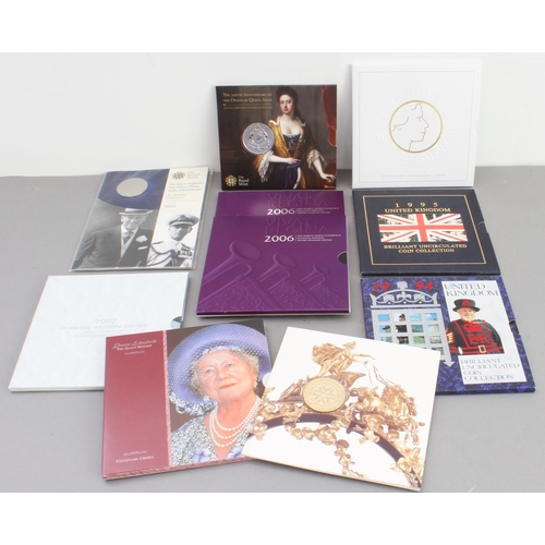 136 - Nine Royal Mint commemorative coins, coin sets and crowns: 
 3 x £5 coins (2003 Coronation Jubilee, ... 