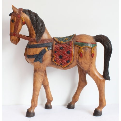 167 - Two hand-carved painted wooden ornamental horses (the larger 61 x 51.5 cm) and a terracotta model of... 
