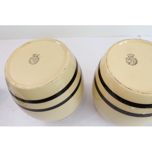 27 - Four pieces:
 1. a pair of late 19th to early 20th century Boch (La Louvière) pottery storage jars a... 