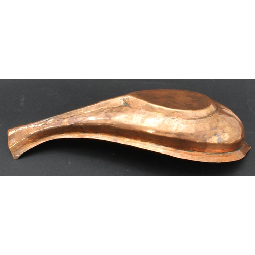 51 - A 19th century Hindu Yoni-ritual copper pourer: ridged bulbous fish form with elongated fishtail pou... 