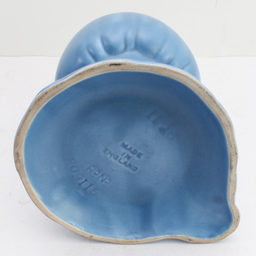 12 - Four ceramic jugs:
 an Art Deco Shelley example with reeded body and varying colours (34 cm high);
 ... 