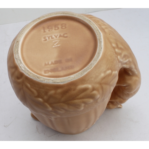 12 - Four ceramic jugs:
 an Art Deco Shelley example with reeded body and varying colours (34 cm high);
 ... 